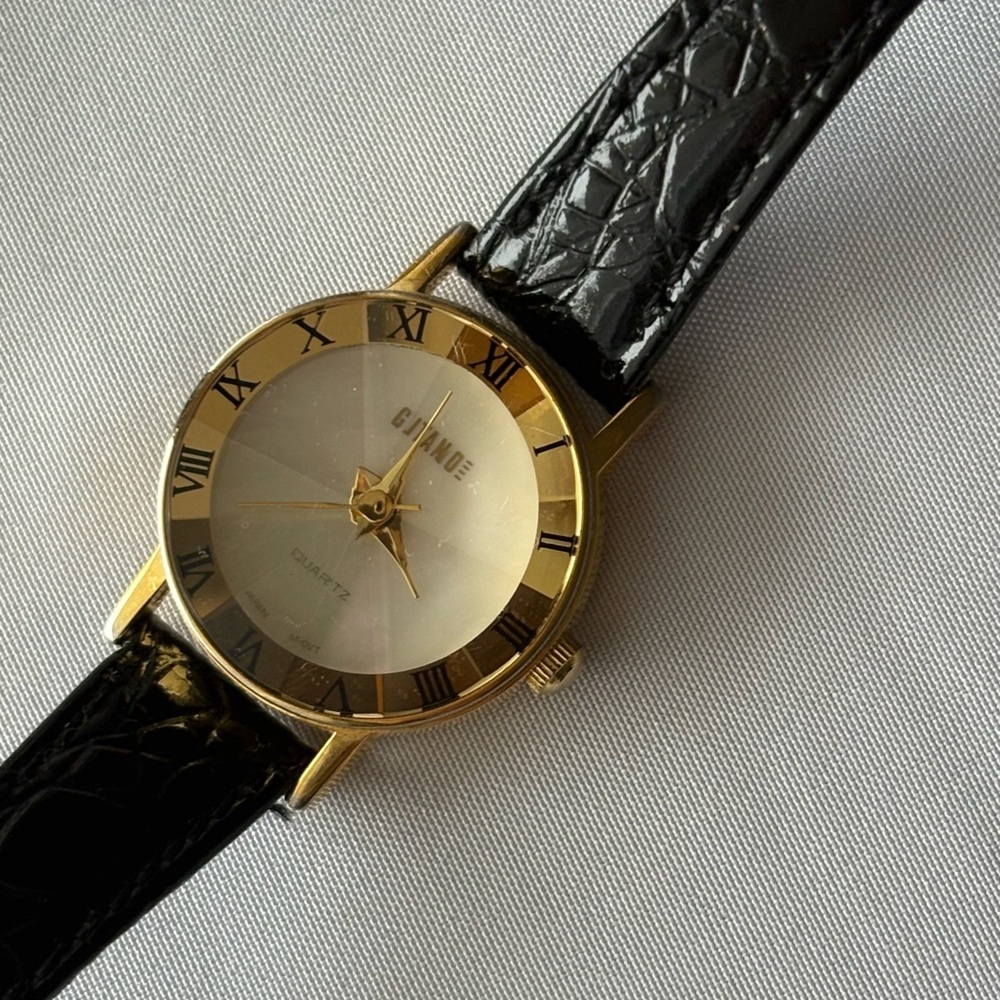 Woman’s Vintage Gold and Black Watch